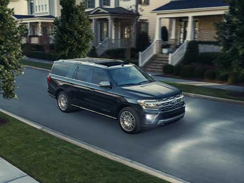 2023 Ford Expedition driving down a street