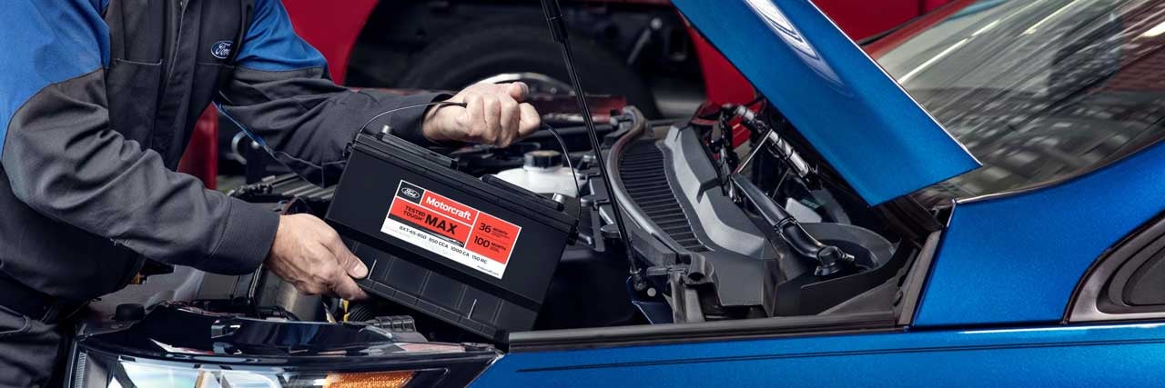 close up of a Ford Technician changing a car battery
