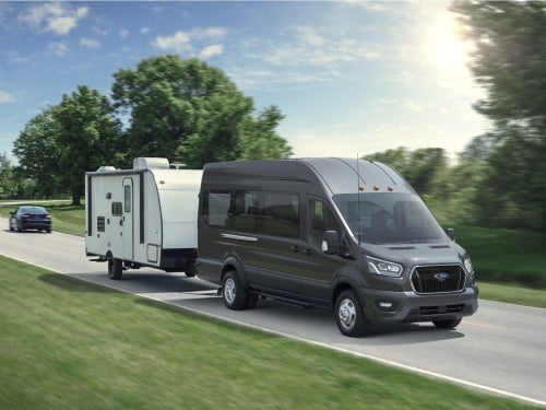 2024 Ford Transit towing a camper