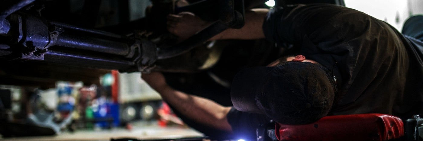 close up view of an engine's driveline being serviced