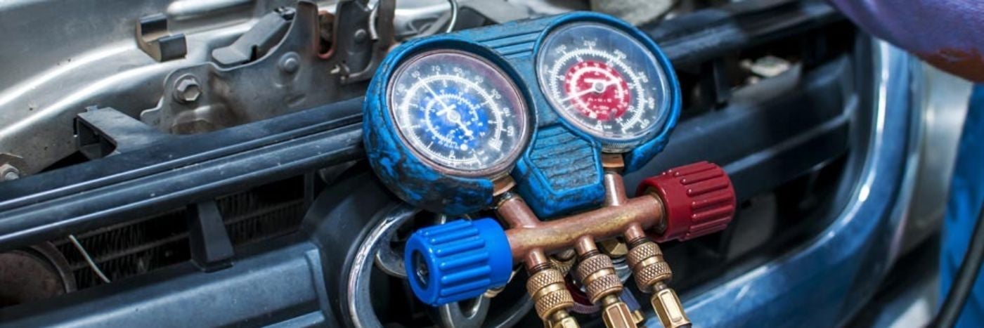 Close up view of gauges hooked up to a vehicle's heating system