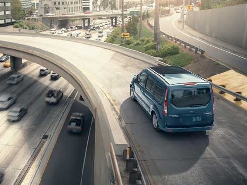 2023 Ford Transit Connect Passenger Wagon driving on ramp on interstate